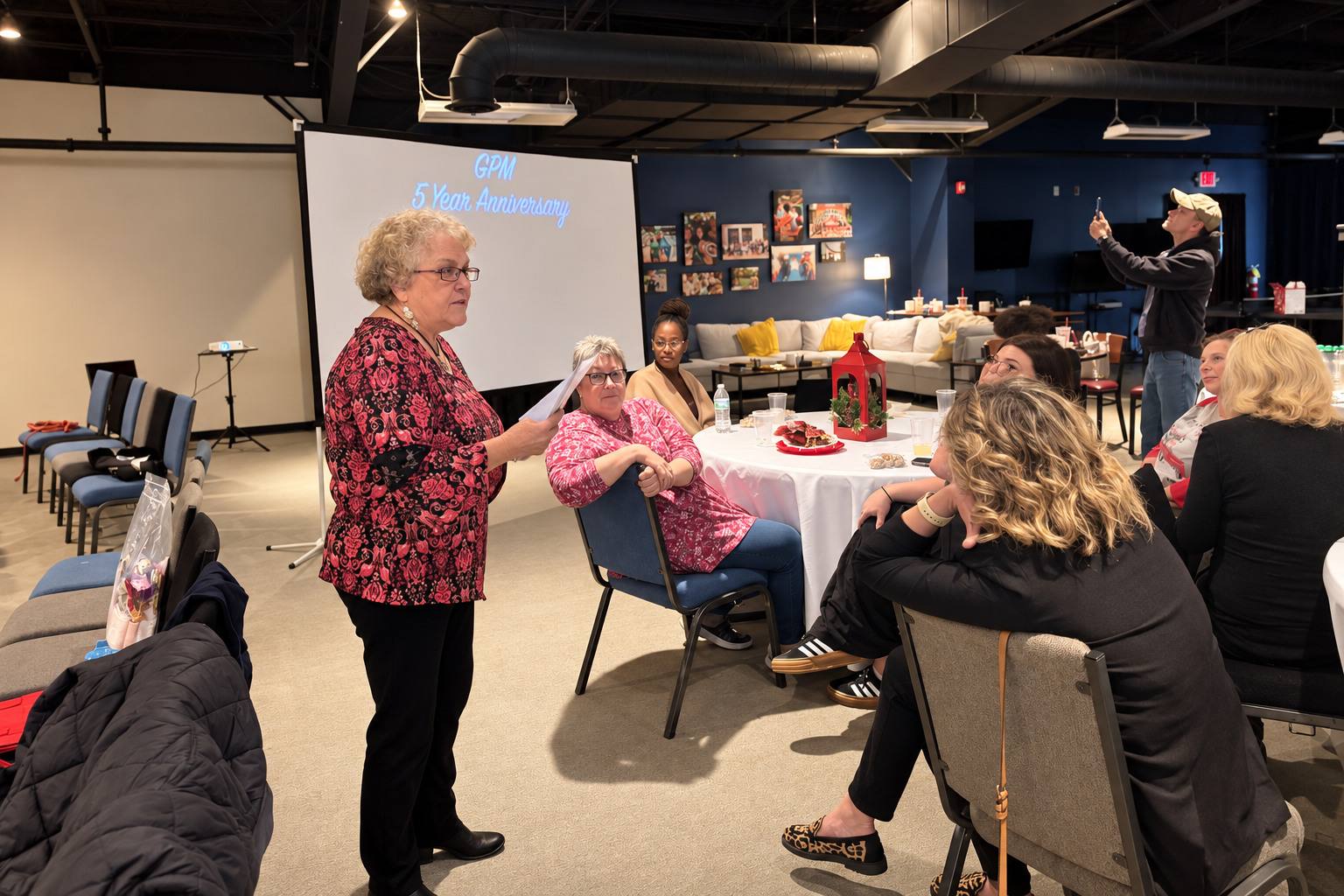 A volunteer speaking at GPM’s 5 year anniversary celebration