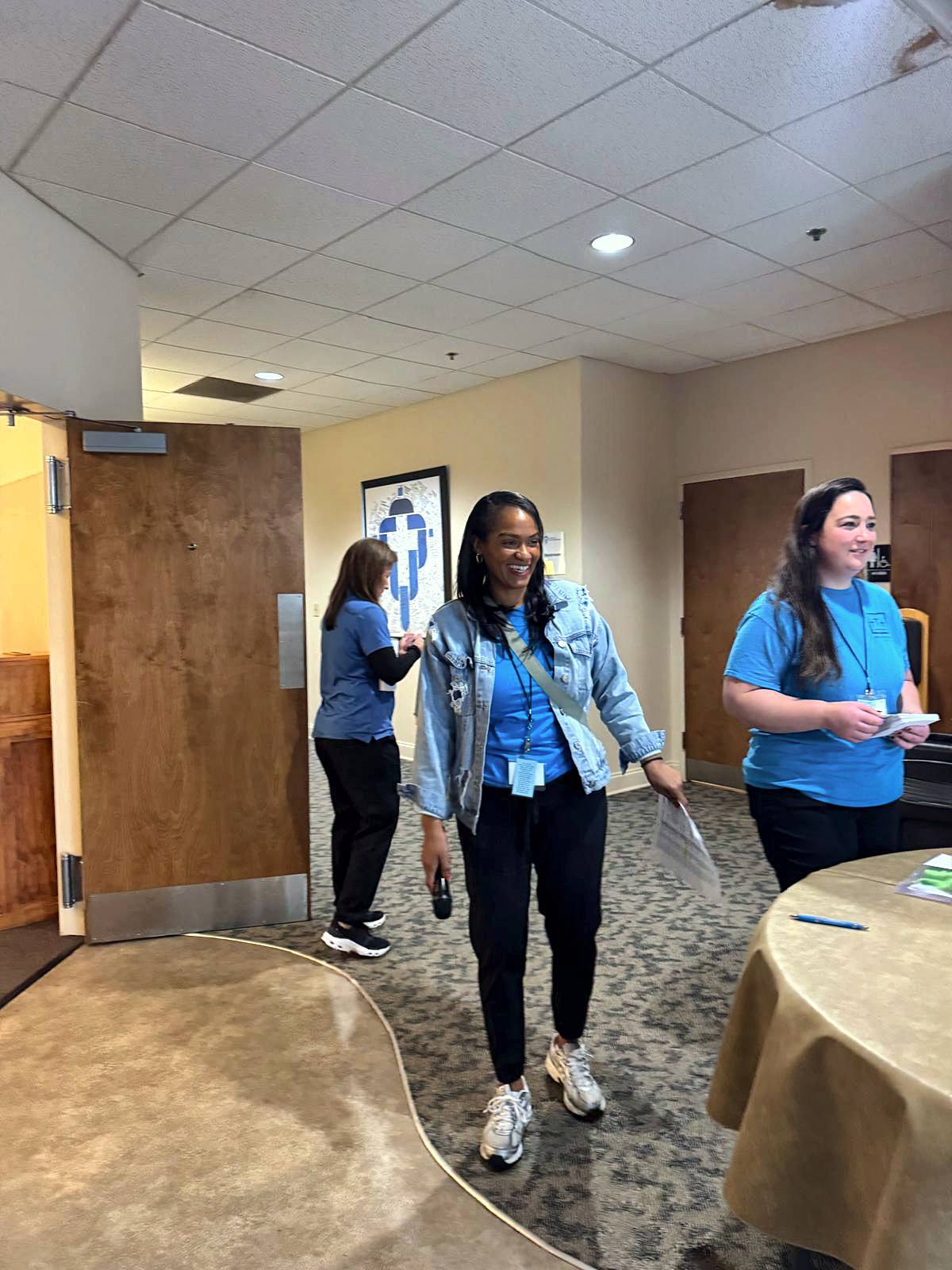 Volunteers walking through the fellowship hall