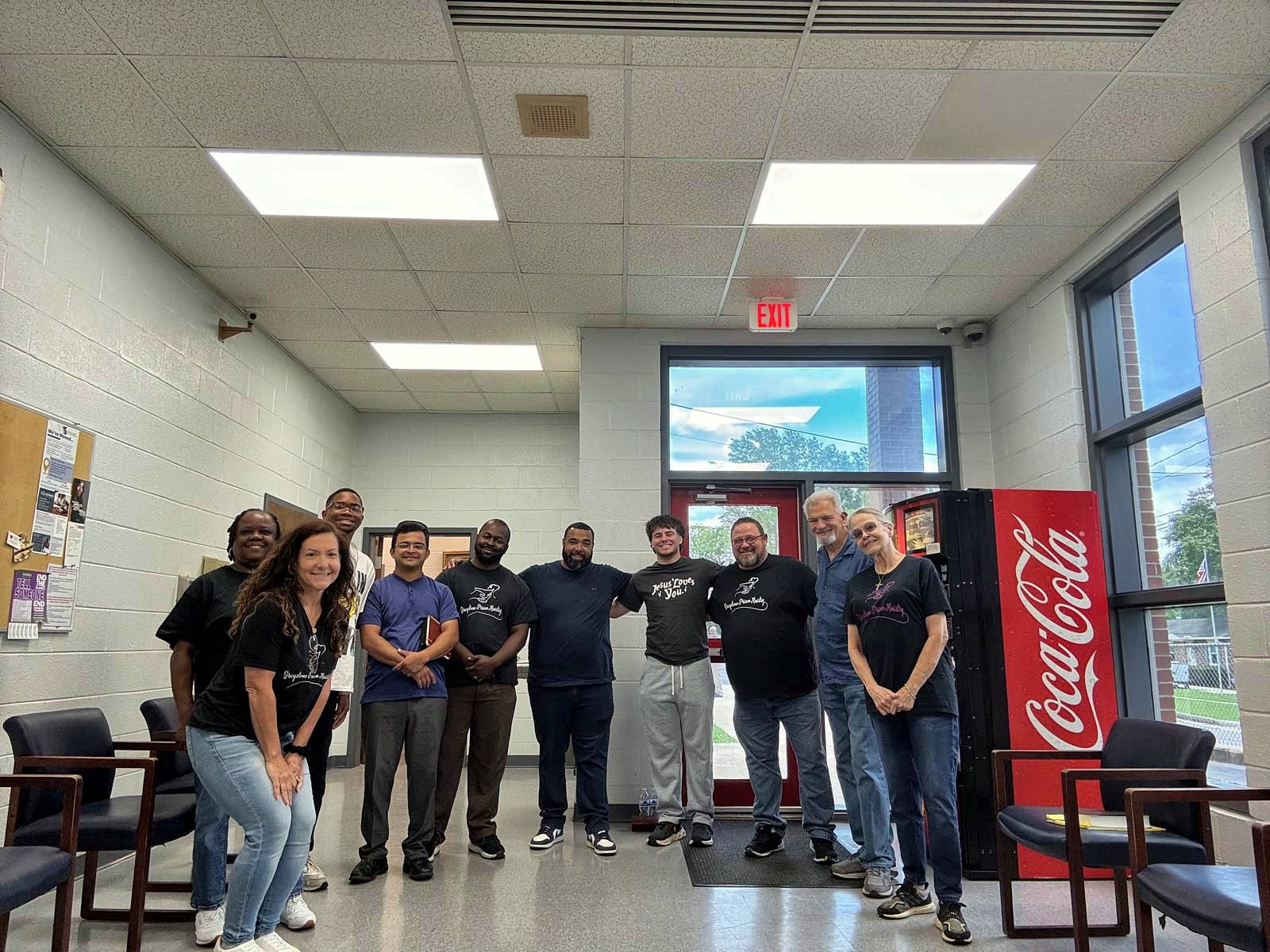 The team gathered in the jail lobby