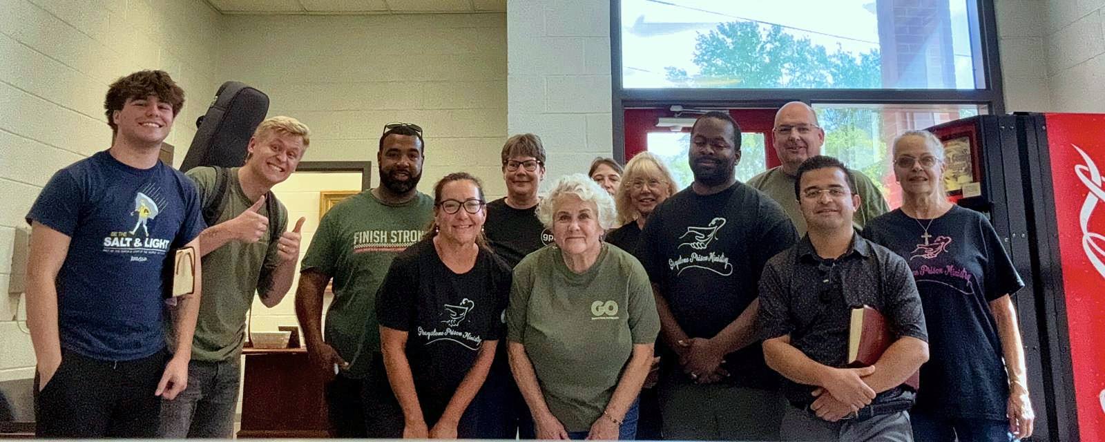 A panoramic photo of volunteers in the jail lobby