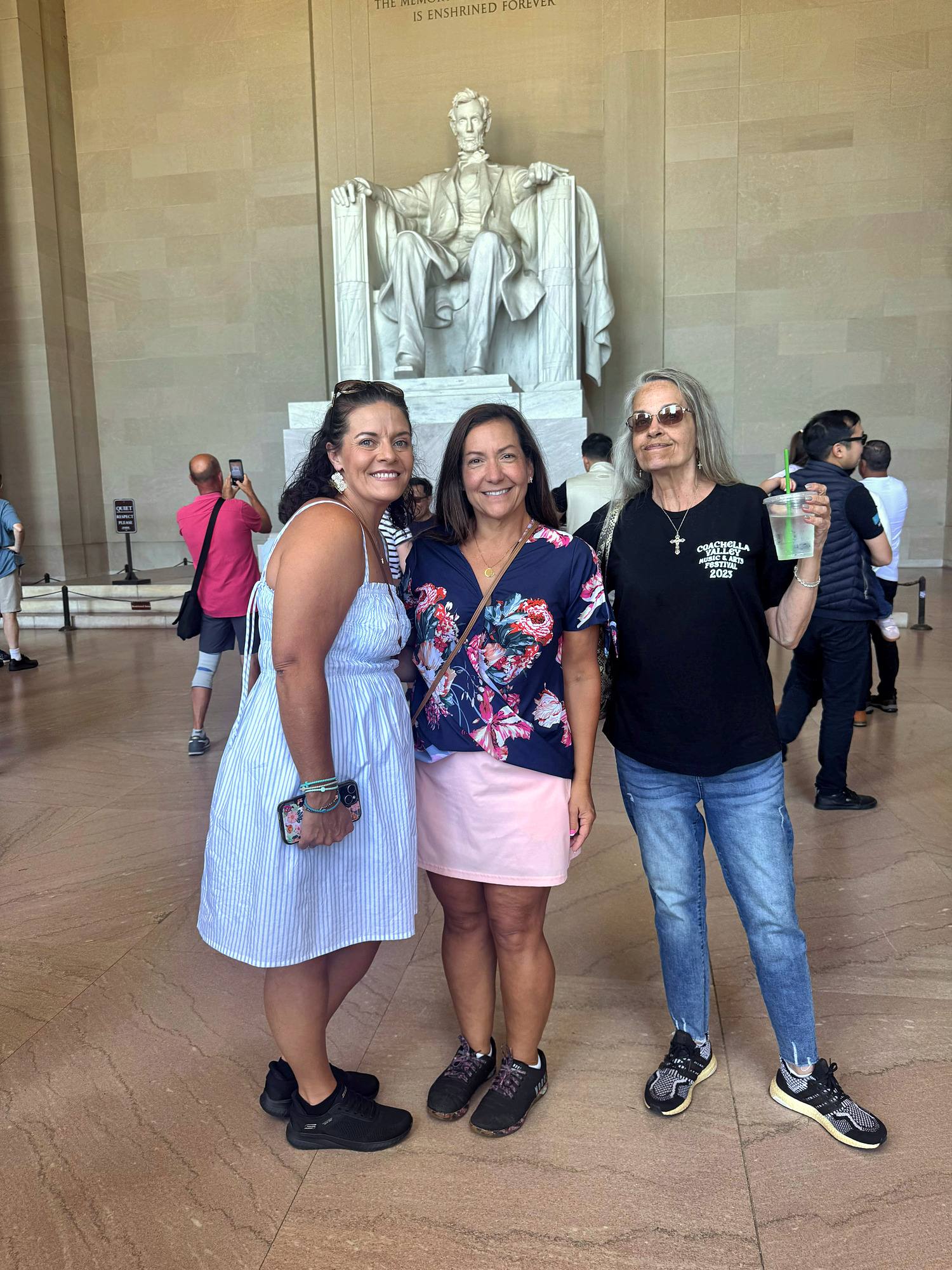 Three women from the team at the Lincoln Memorial