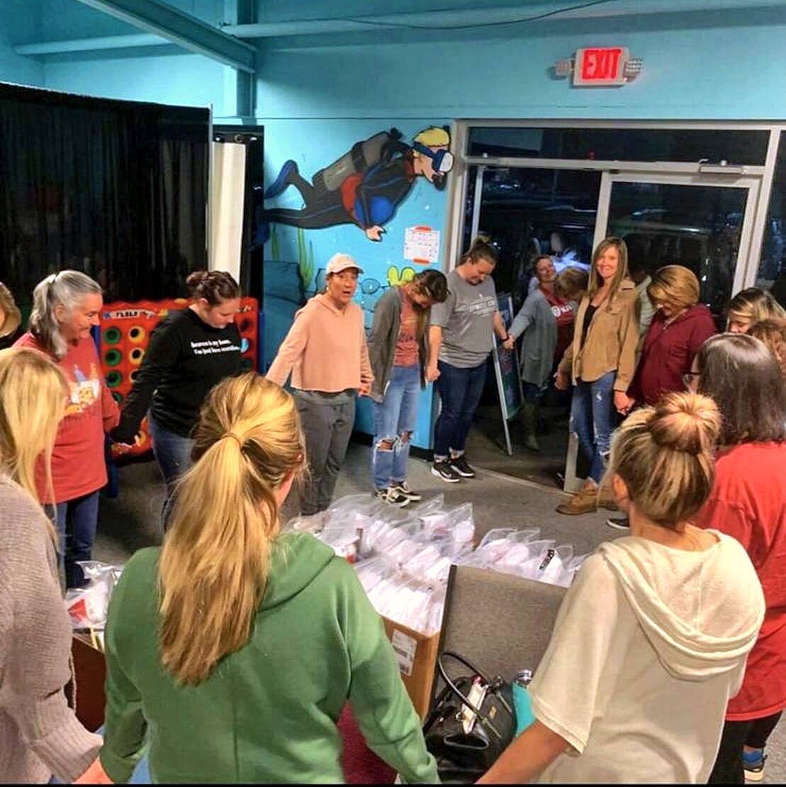 A Graystone small group praying in a circle