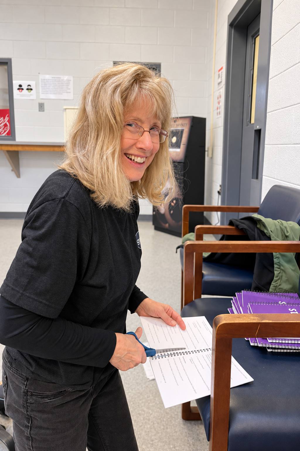 Sue, smiling as she signs in at the jail