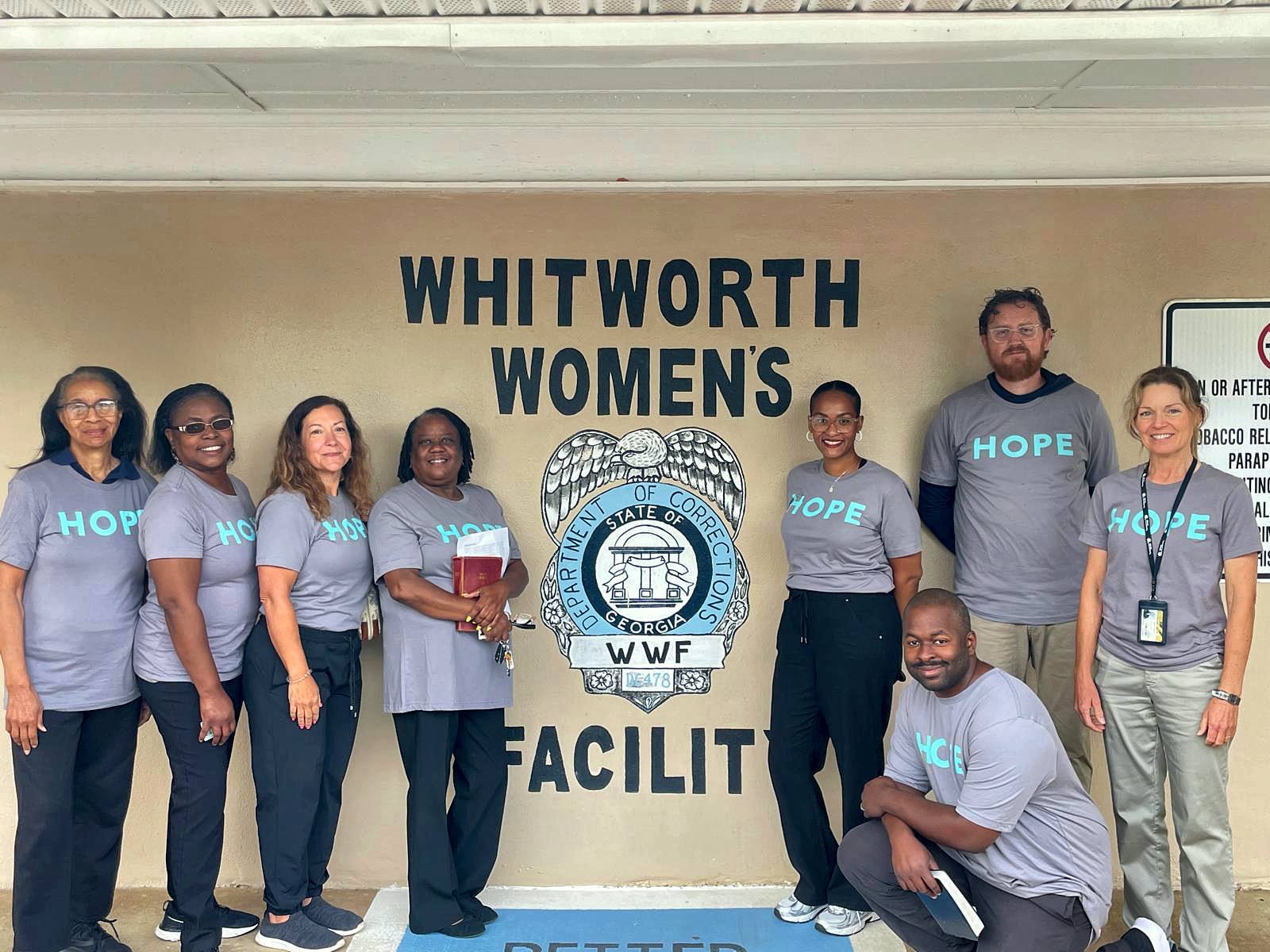 Volunteers in HOPE shirts at the Whitworth Women’s Facility seal